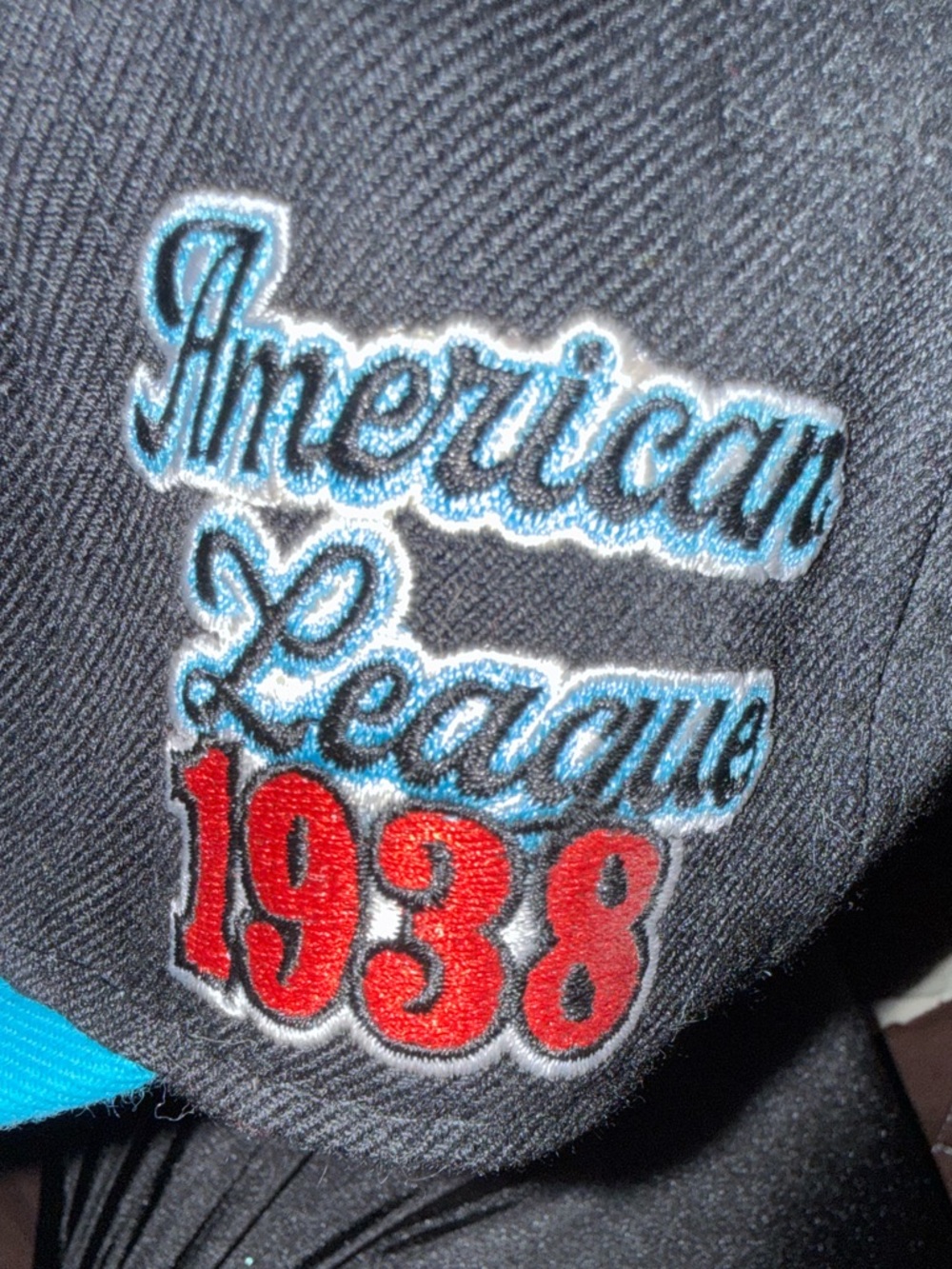 Nostalgia Black Cap with Red Memphis Emblem and Teal Brim also a St. Paul’s hat.
